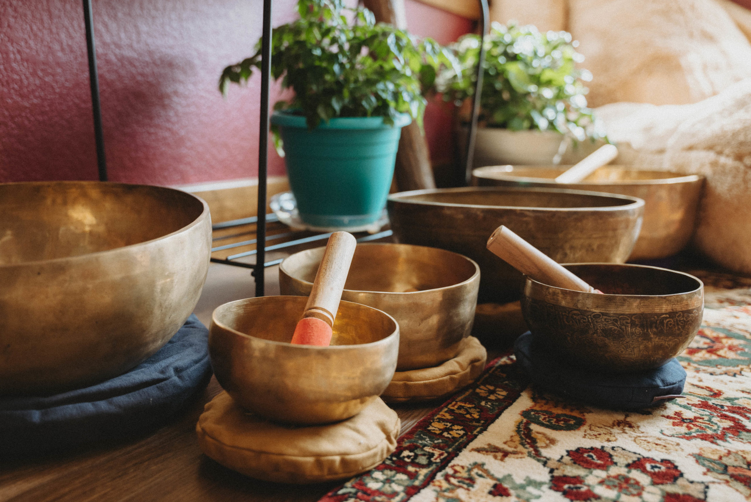 Brass singing bowls on a floor