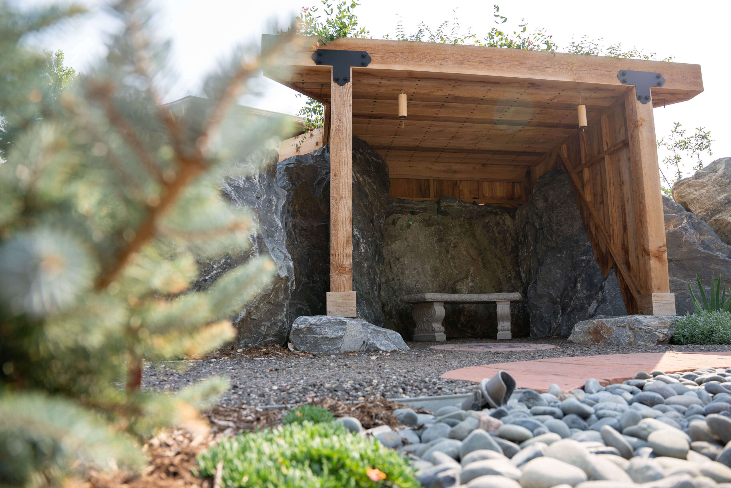 Rock grotto with wood frame and roof