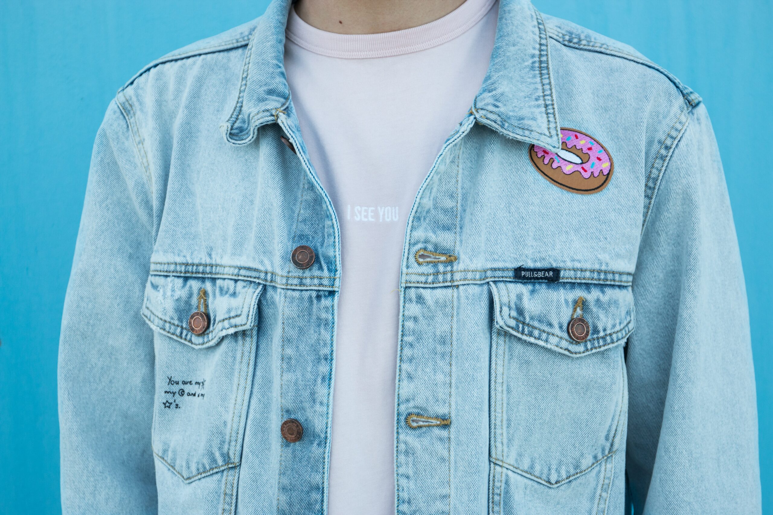 Journal close up of a person wearing a jean jacket