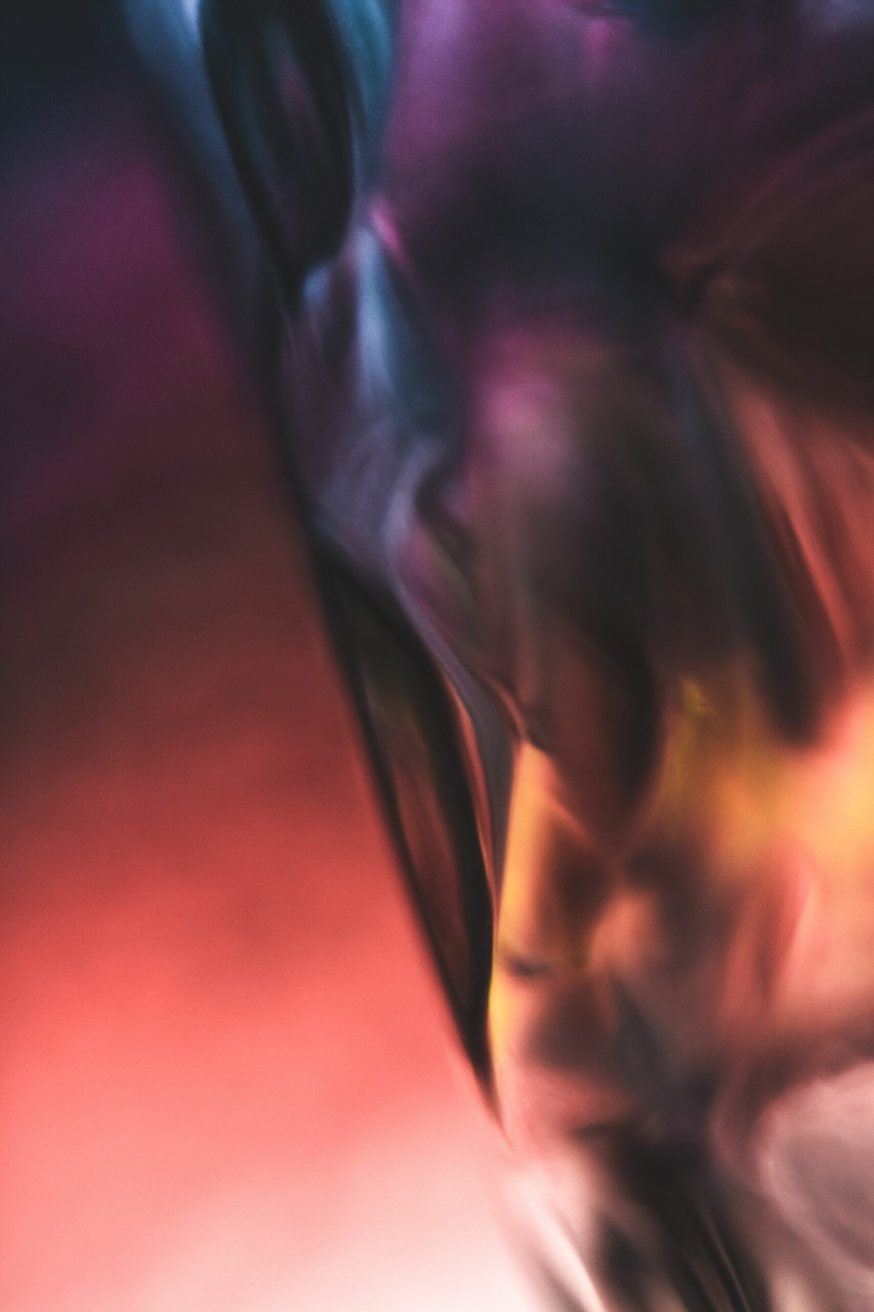 Podcast close up of a blurry red purple and yellow shape